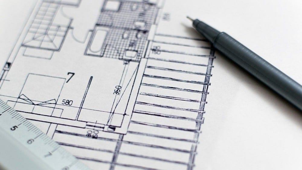 A measured property drawing with a ruler and pen